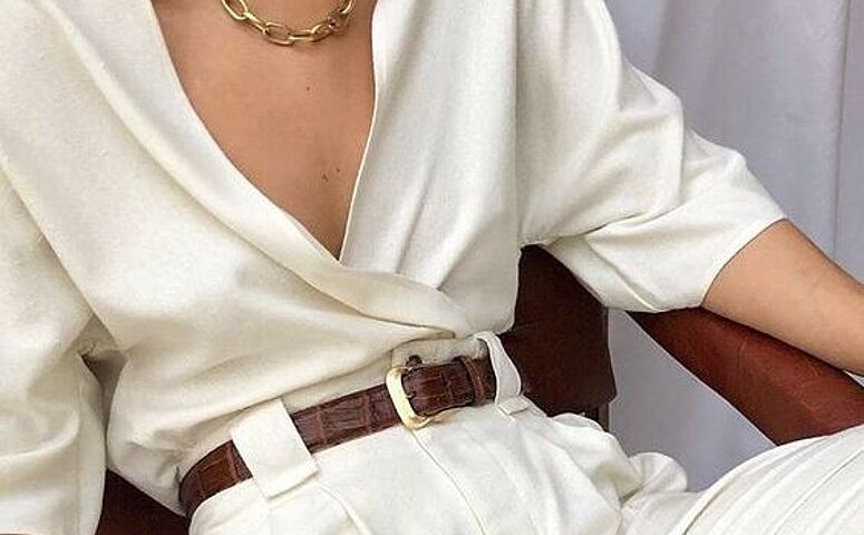 women-in-white-pants-and-white-blouse-sitting-with-brown-belt